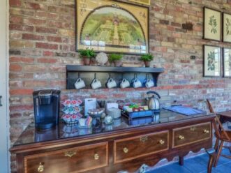 coffee cups sre hung over a coffee station in the breakfast room